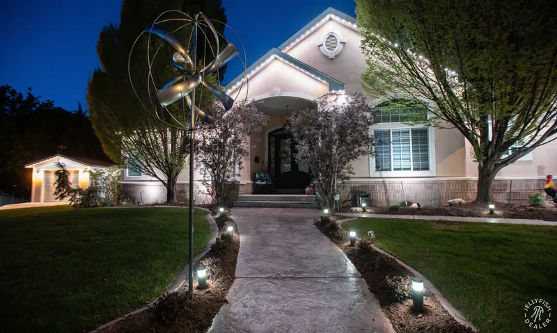 Warm-white exterior and pathway lighting at dusk